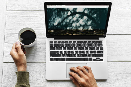 laptop work with coffee on desk