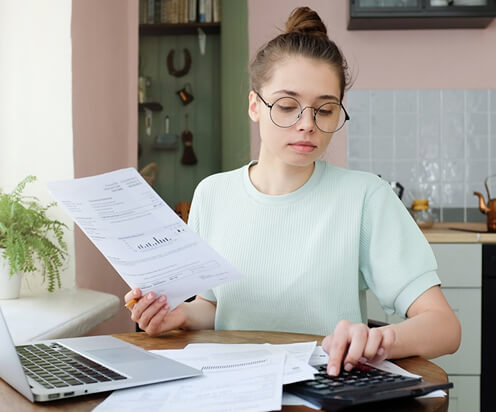 woman reviewing bills and budgeting